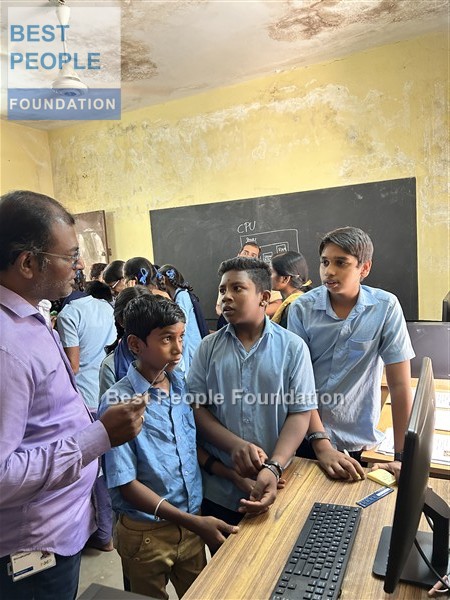 Instructor demonstrating electronic components