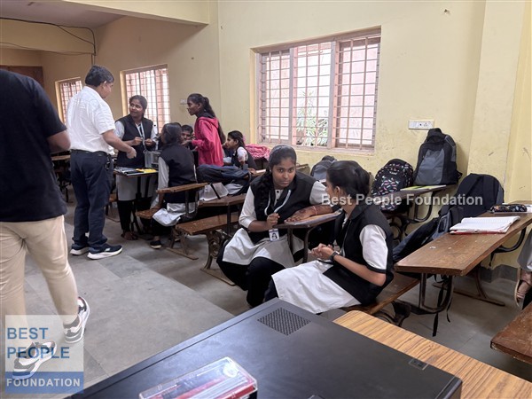 Students holding computer processors and memory chips during a hardware learning session