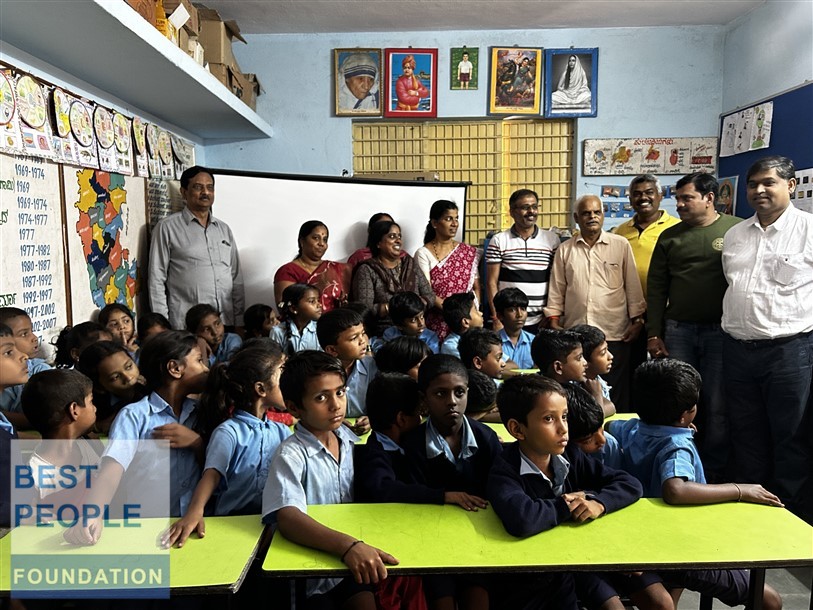 Volunteer explaining computer components to students