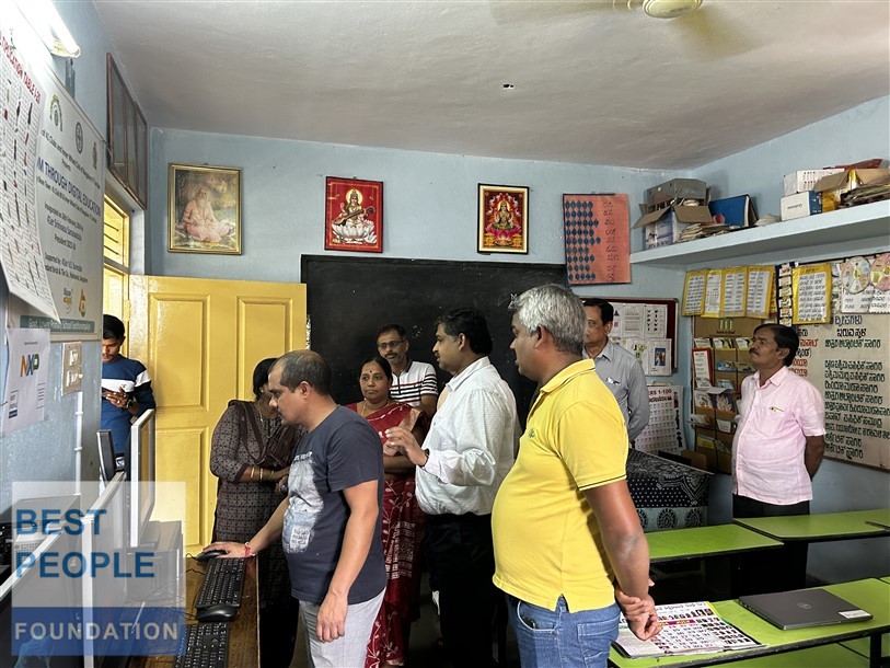 Teacher and students at the computer station